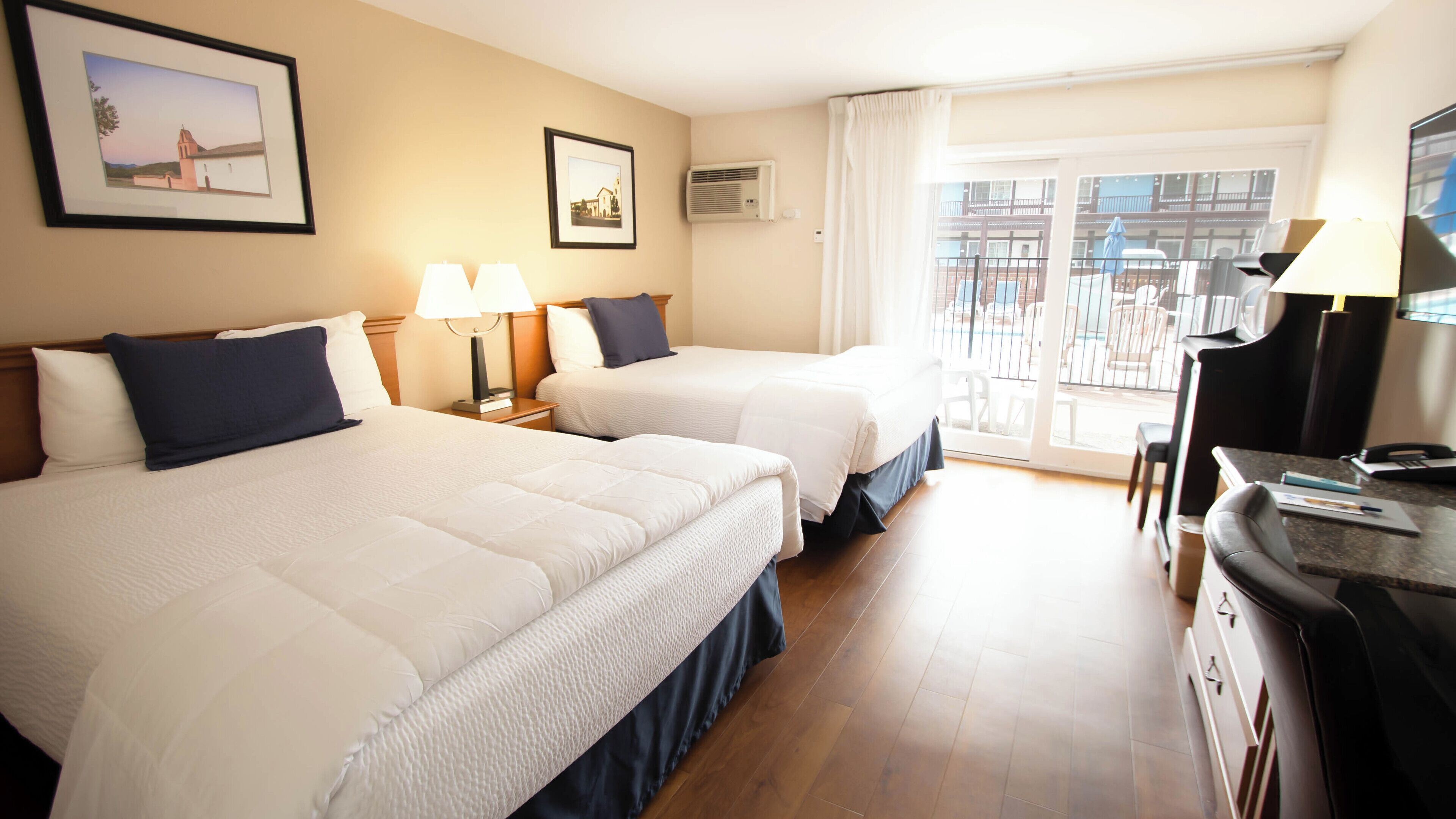 signature room, 2 queen beds, patio, ground floor | 1 bedroom, individually furnished, desk, laptop workspace