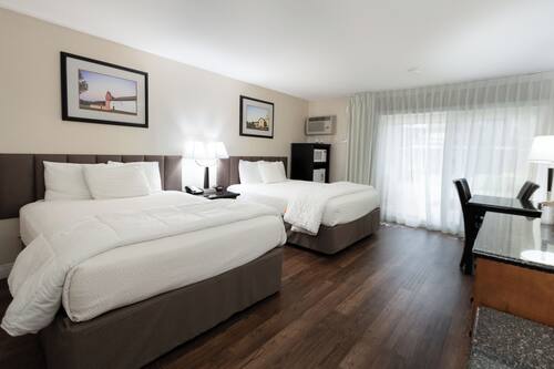 Signature Room, 2 Queen Beds, Patio, Ground Floor | Individually furnished, desk, laptop workspace, iron/ironing board