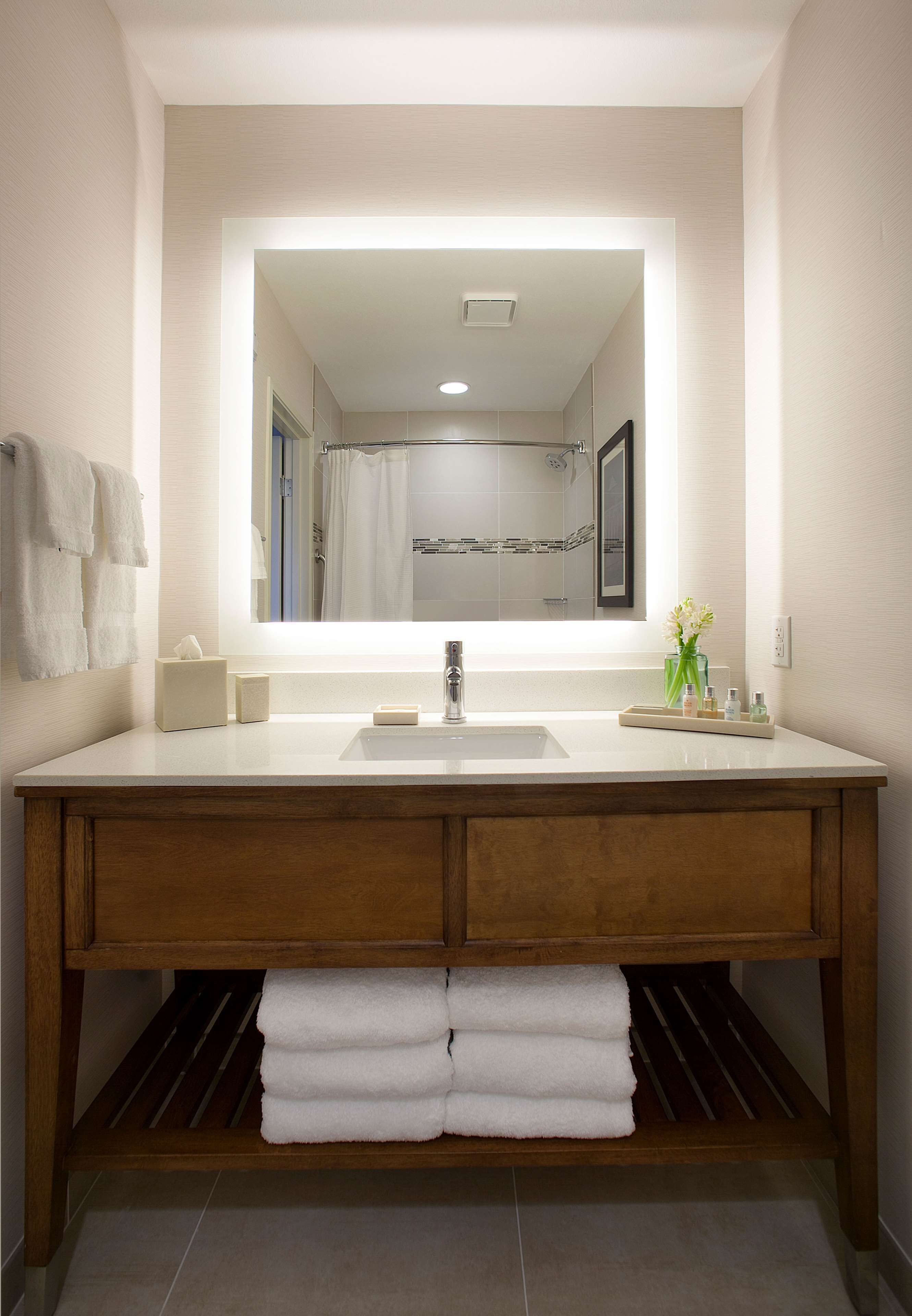 combined shower/bathtub, designer toiletries, hair dryer, bathrobes