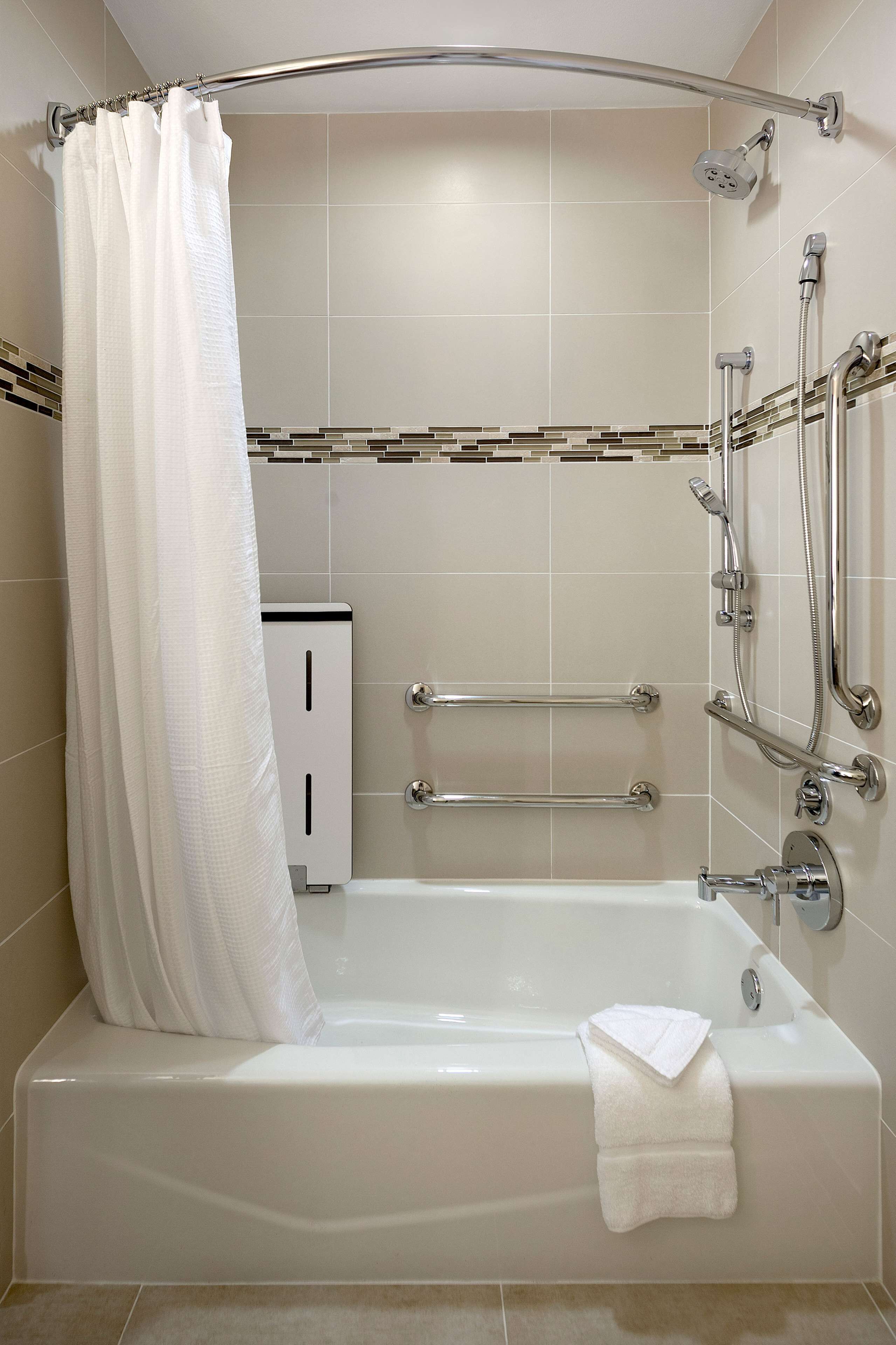 combined shower/bathtub, designer toiletries, hair dryer, bathrobes