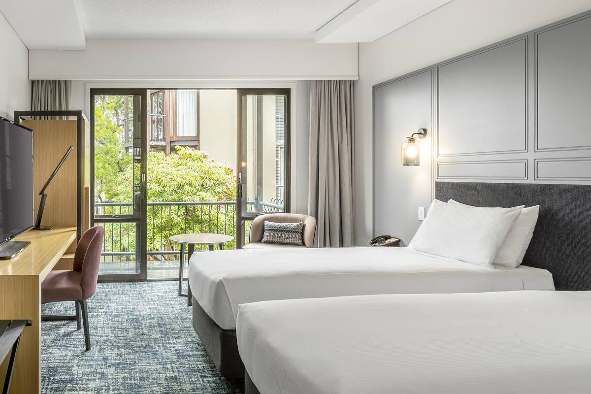 deluxe twin room, balcony | down duvets, in-room safe, individually furnished, desk