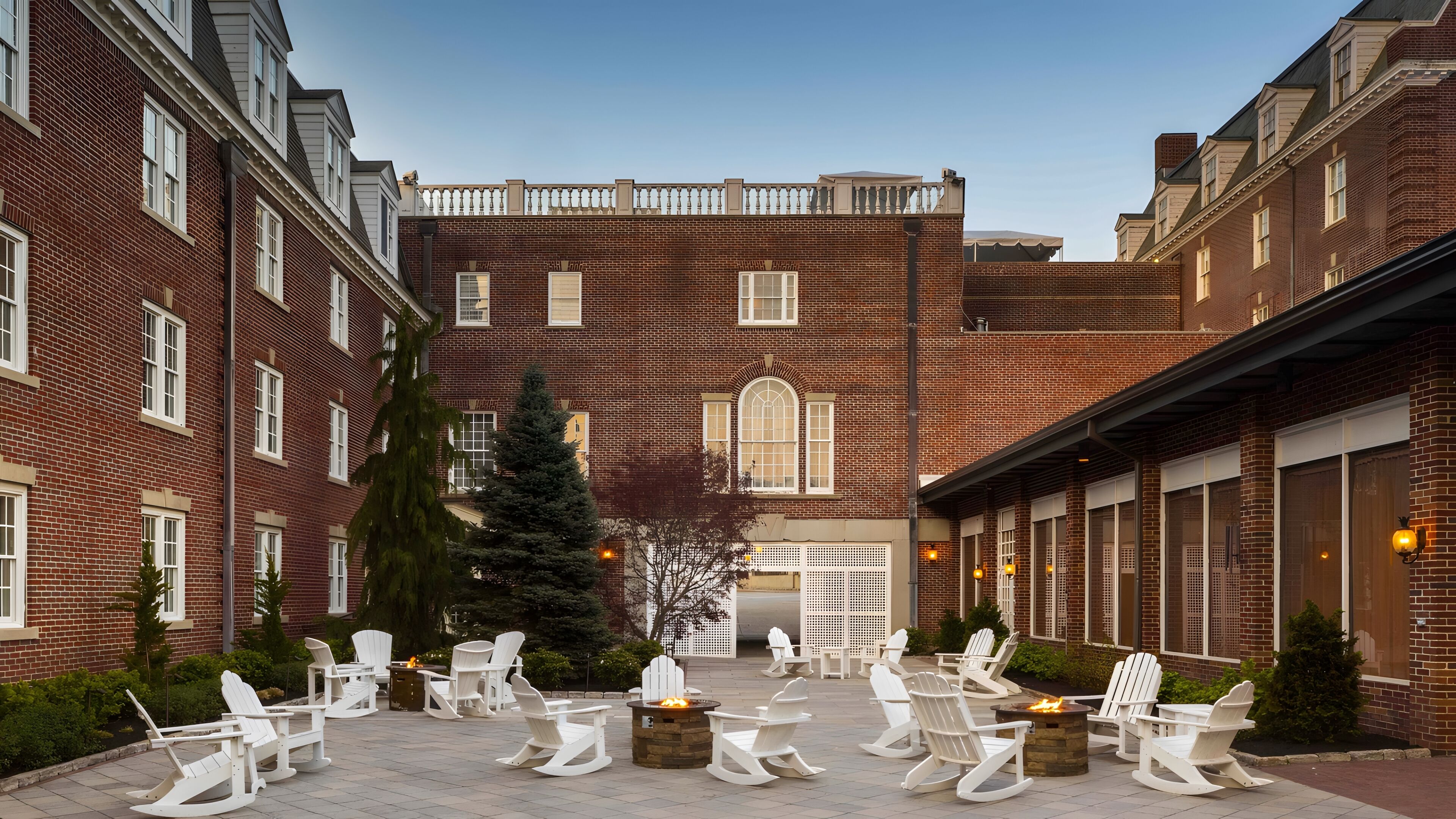 A courtyard with outdoor seating and a fire pit.
