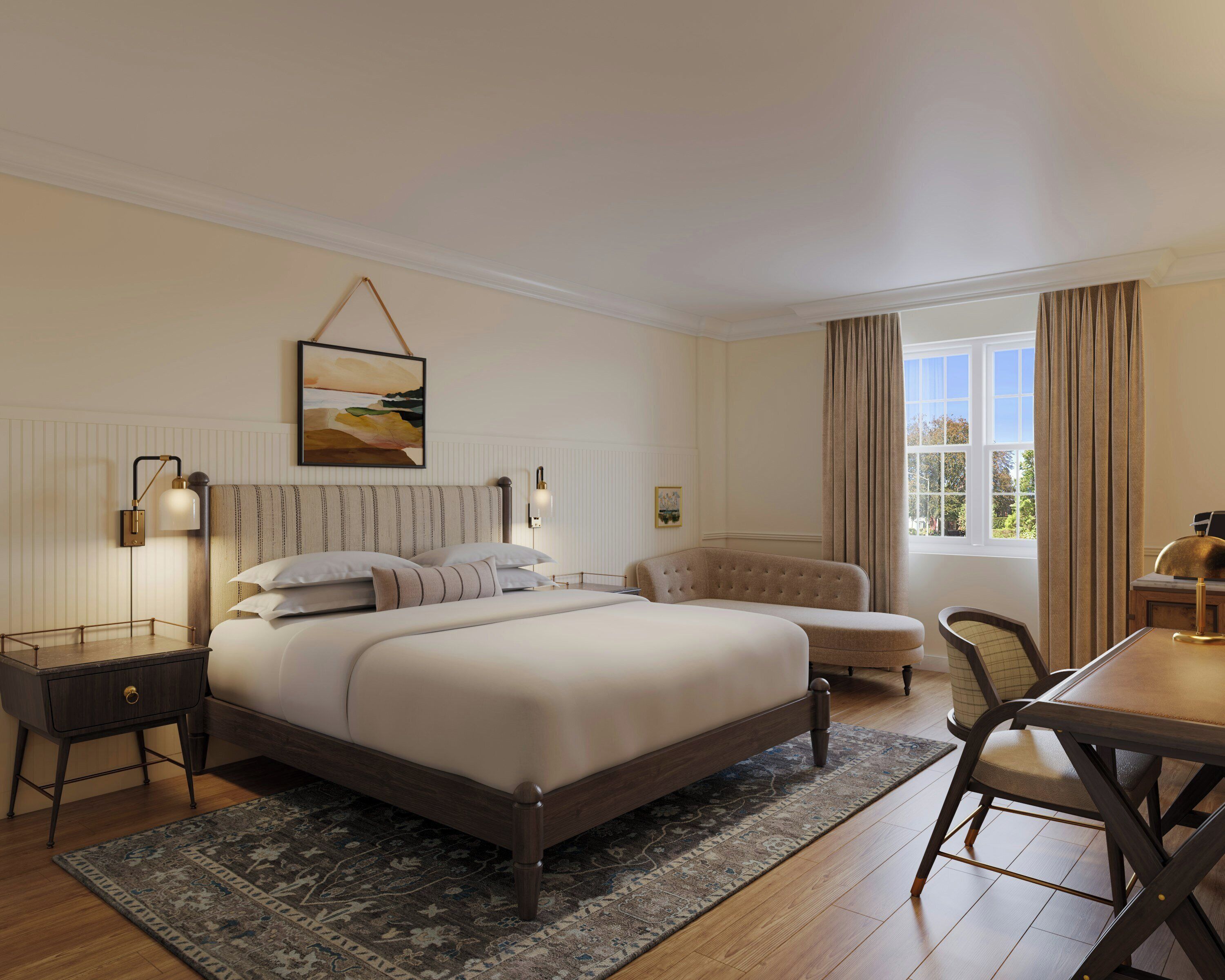 Habitación de hotel con una cama grande, mesitas de noche, un escritorio y vistas al exterior.