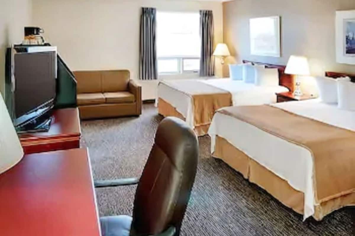 Desk, blackout drapes, iron/ironing board, free cribs/infant beds