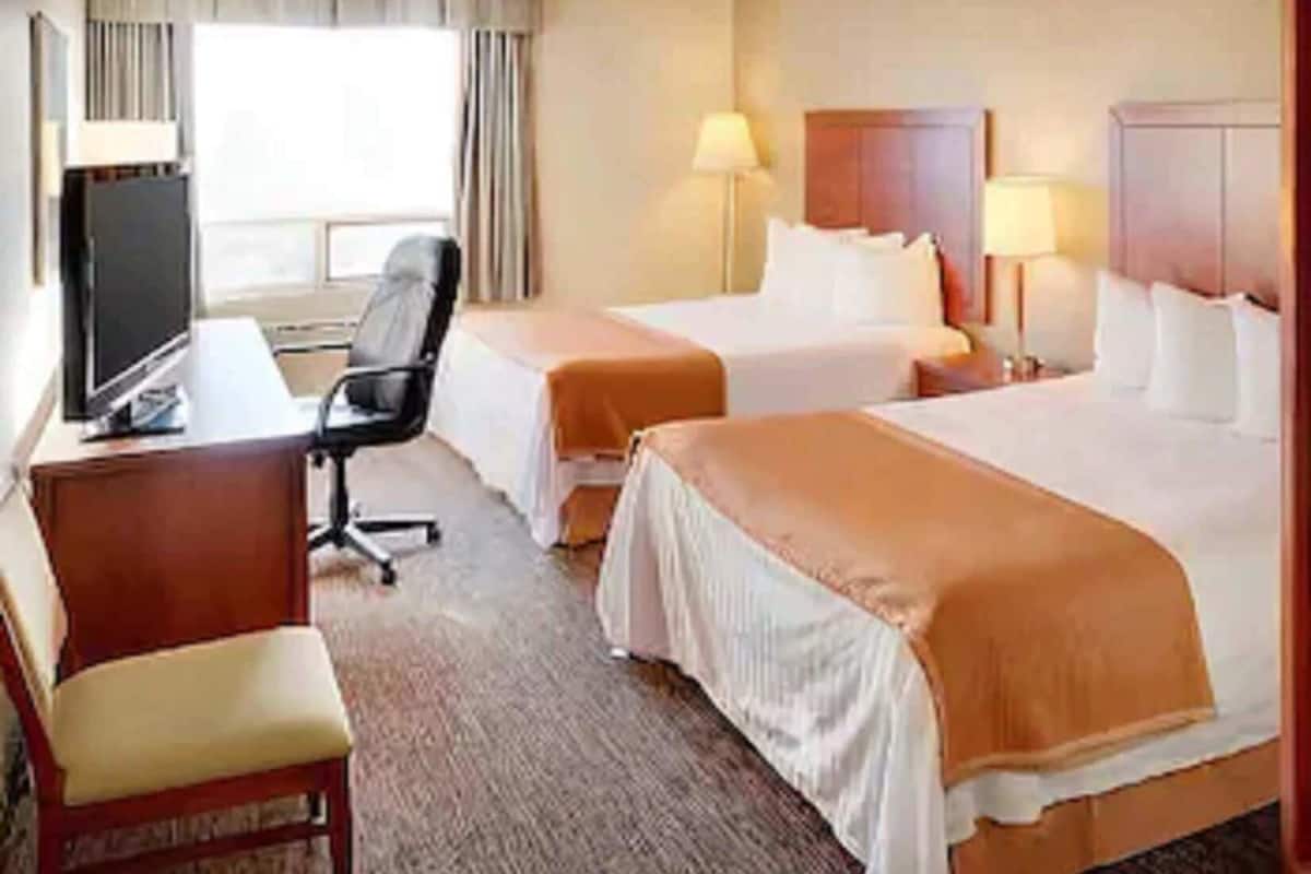 Desk, blackout drapes, iron/ironing board, free cribs/infant beds