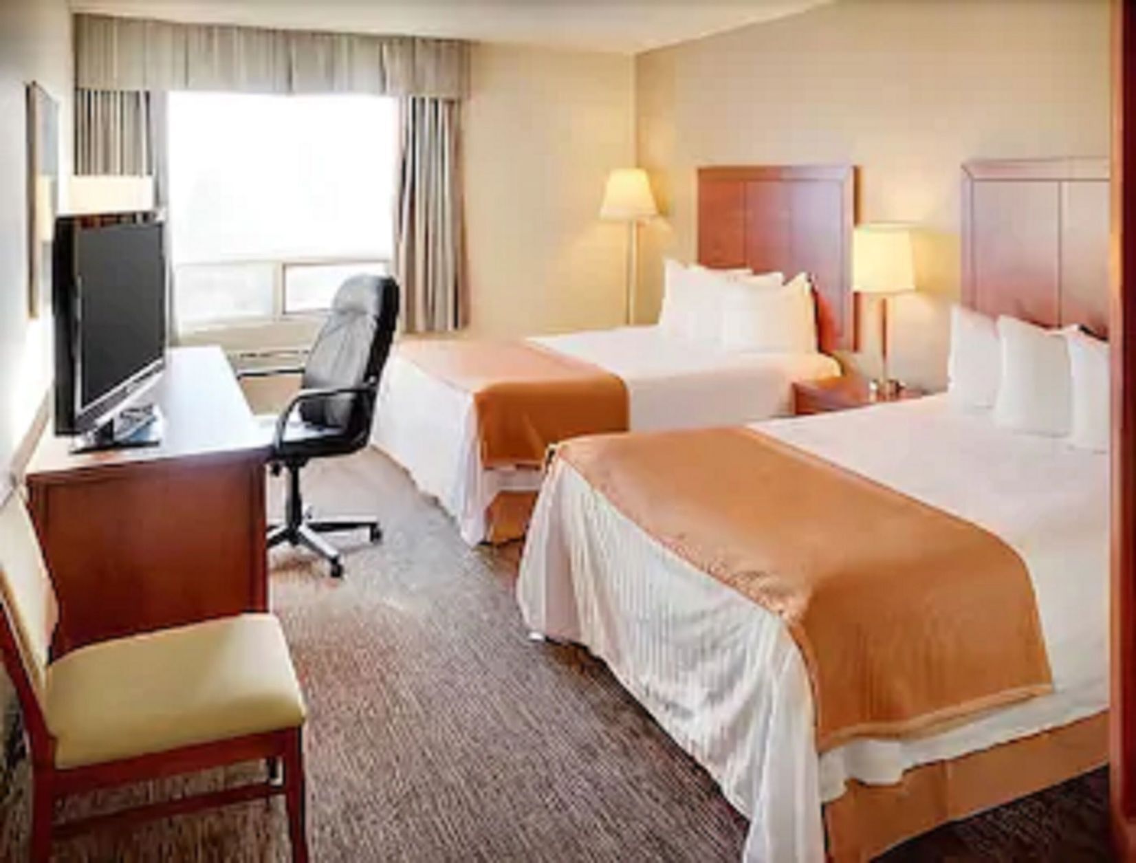 Desk, blackout drapes, iron/ironing board, free cribs/infant beds