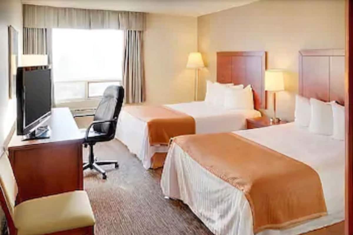 Desk, blackout drapes, iron/ironing board, free cribs/infant beds