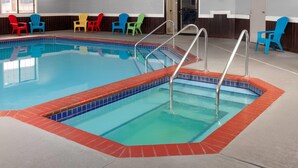 An indoor swimming pool with a tiled edge and a red border.