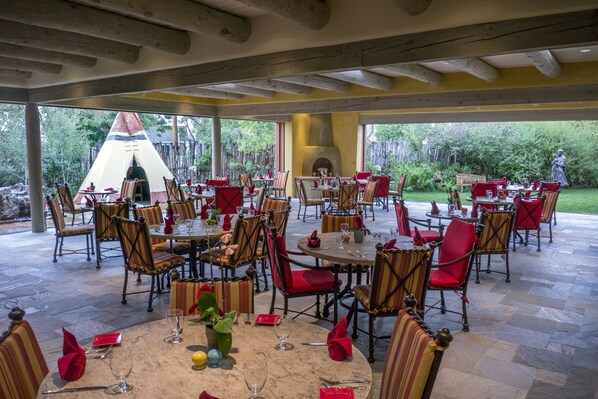 Breakfast, lunch, dinner served; Regional cuisine, garden views 