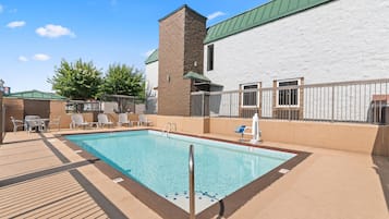 Seasonal outdoor pool, open 10:00 AM to 10:00 PM, pool umbrellas