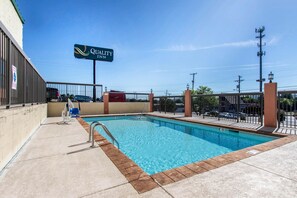 Seasonal outdoor pool, open 10:00 AM to 10:00 PM, pool umbrellas
