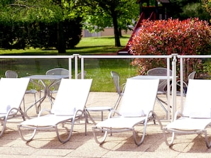 Seasonal outdoor pool, pool umbrellas, pool loungers