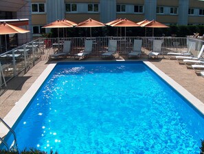 Seasonal outdoor pool, pool umbrellas, pool loungers