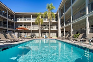 Outdoor pool, open 8:00 AM to 10:00 PM, pool umbrellas, pool loungers