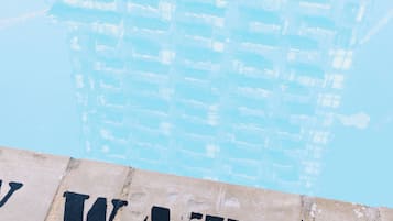 Seasonal outdoor pool, open 6:30 AM to 10:00 PM, pool loungers