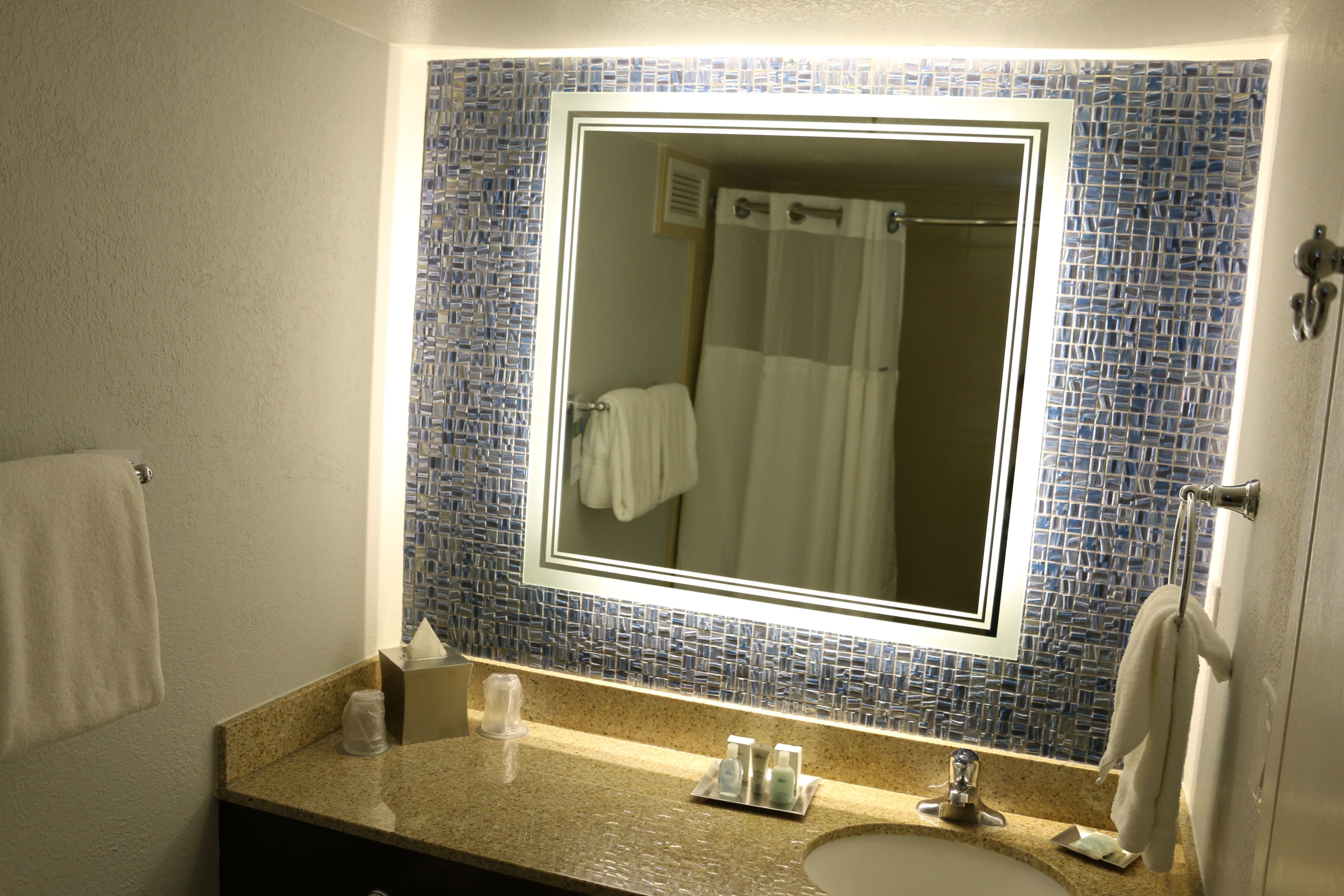 combined shower/bathtub, designer toiletries, hair dryer, towels