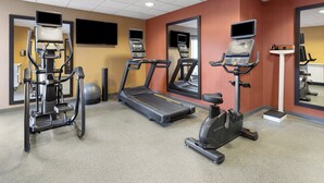 A gym with treadmills, elliptical machines, and a stationary bike. - Holiday Inn Express Augusta Downtown by IHG (Augusta)