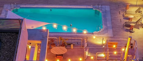 Outdoor pool, open 10:00 AM to 8:00 PM, pool umbrellas, pool loungers