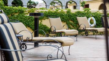 Outdoor pool, open 7:00 AM to 10:00 PM, pool loungers