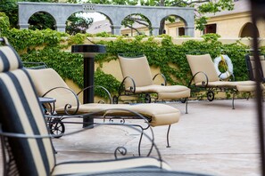 Outdoor pool, open 7:00 AM to 10:00 PM, sun loungers