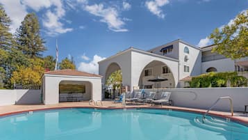 Outdoor pool, open 7:00 AM to 10:00 PM, pool loungers