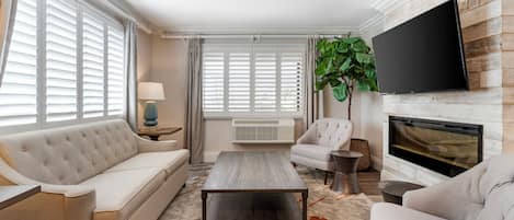 Suite, 1 King Bed, Non Smoking, Fireplace (with Sofabed) | Living area | 55-inch flat-screen TV with satellite channels, TV
