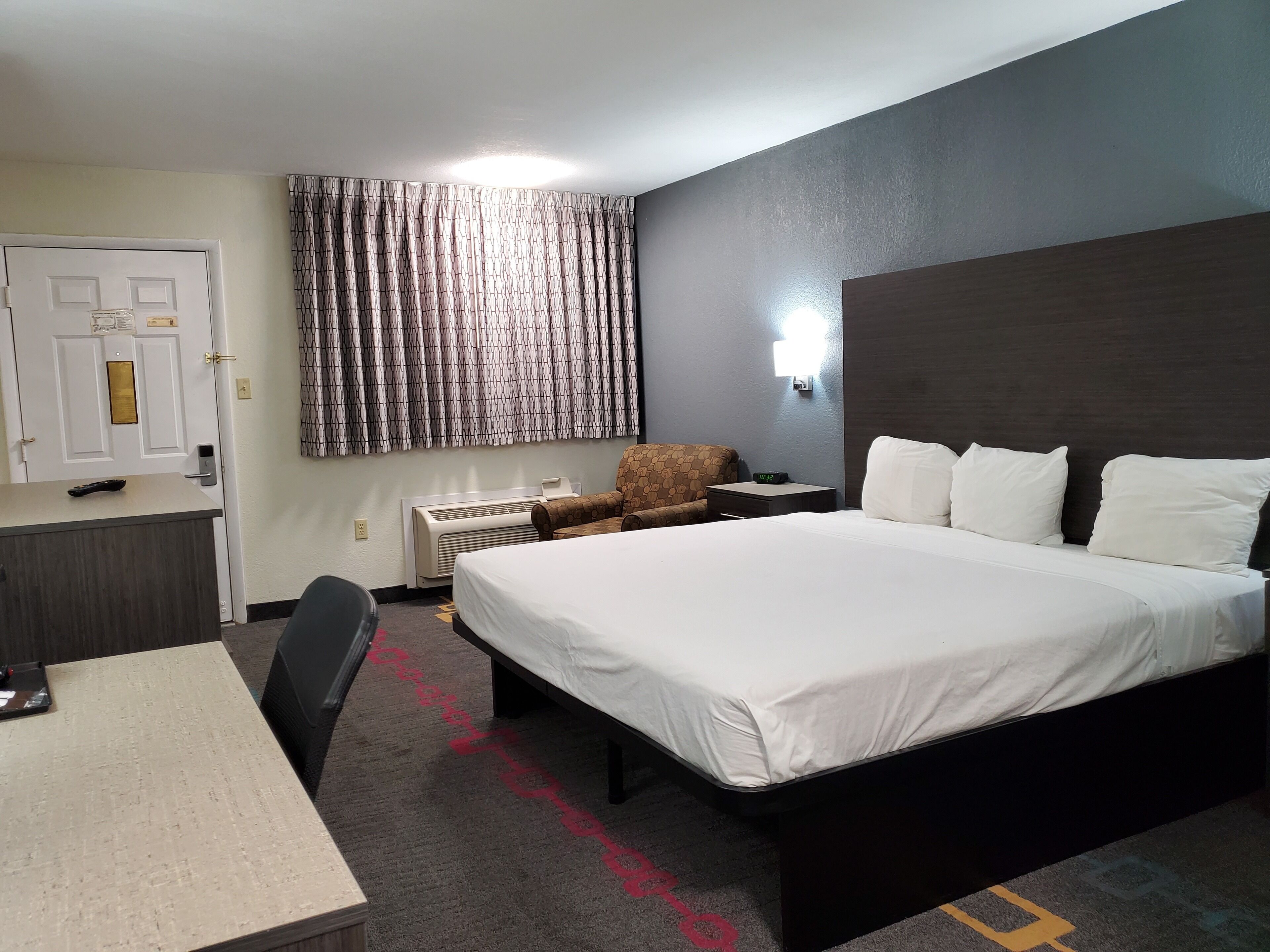 Suite, 1 King Bed, Smoking (One-Bedroom) | Desk, iron/ironing board, free cots/infant beds, rollaway beds