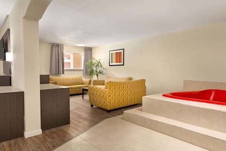 Suite, 1 King Bed, Non Smoking (One-Bedroom) | Desk, iron/ironing board, free cribs/infant beds, rollaway beds