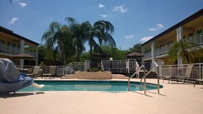 Outdoor pool, open 7:00 AM to 9:00 PM, pool umbrellas
