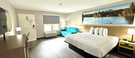1 King Bed, Suite, Non-Smoking | Desk, laptop workspace, blackout curtains, iron/ironing board