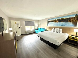 1 King Bed, Suite, Non-Smoking | Desk, laptop workspace, blackout drapes, iron/ironing board