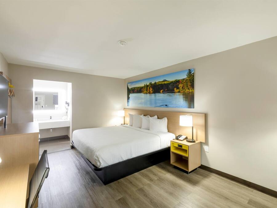 Desk, laptop workspace, blackout curtains, iron/ironing board