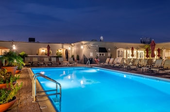 Outdoor pool, a heated pool, open 5:00 AM to 10:00 PM, sun loungers at Omni Royal Orleans Hotel