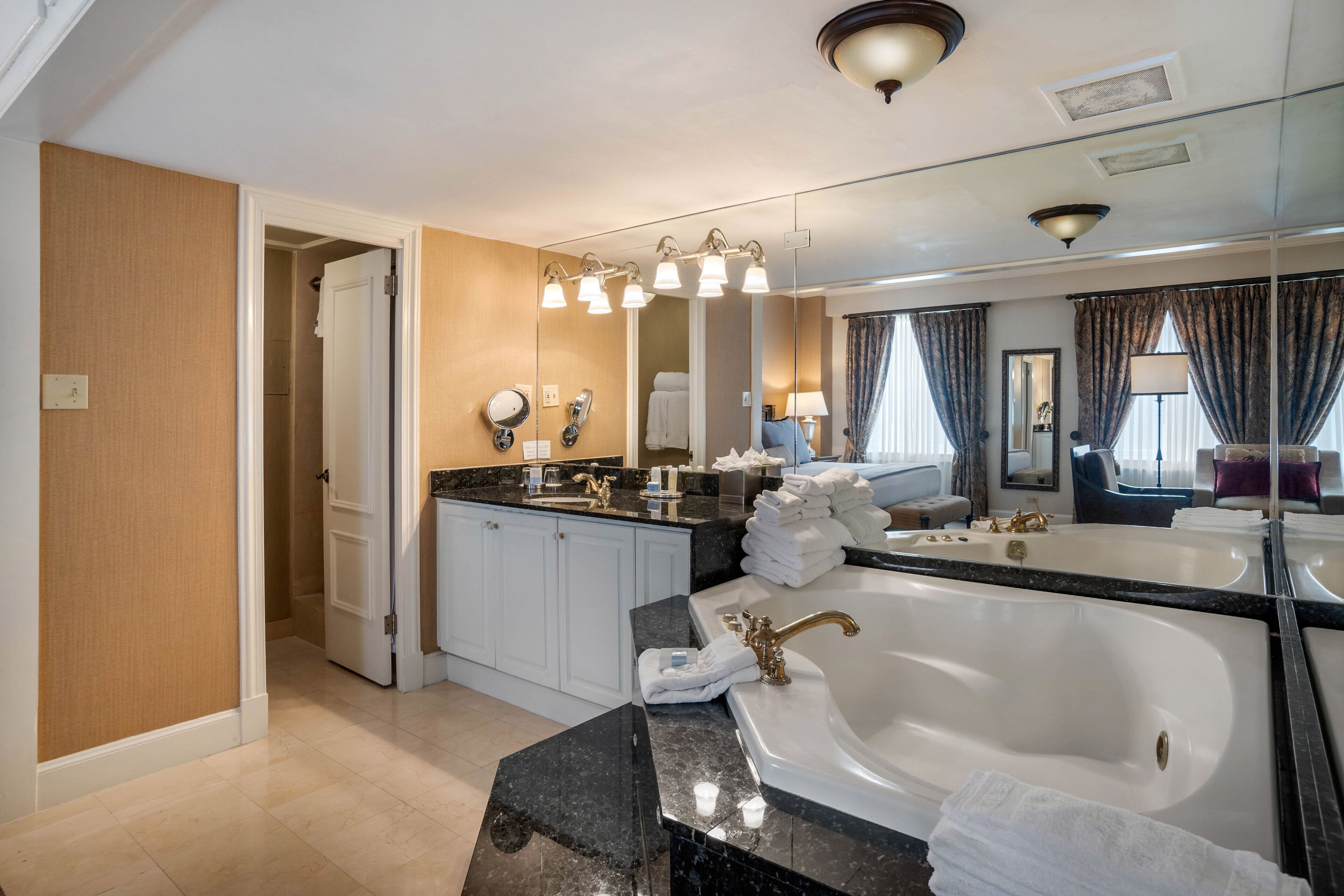 suite, 1 king bed, jetted tub (petite) | bathroom | eco-friendly toiletries, hair dryer, bathrobes, towels