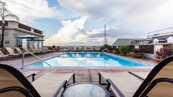 Outdoor pool, a heated pool, open 6:00 AM to 10:00 PM, pool umbrellas