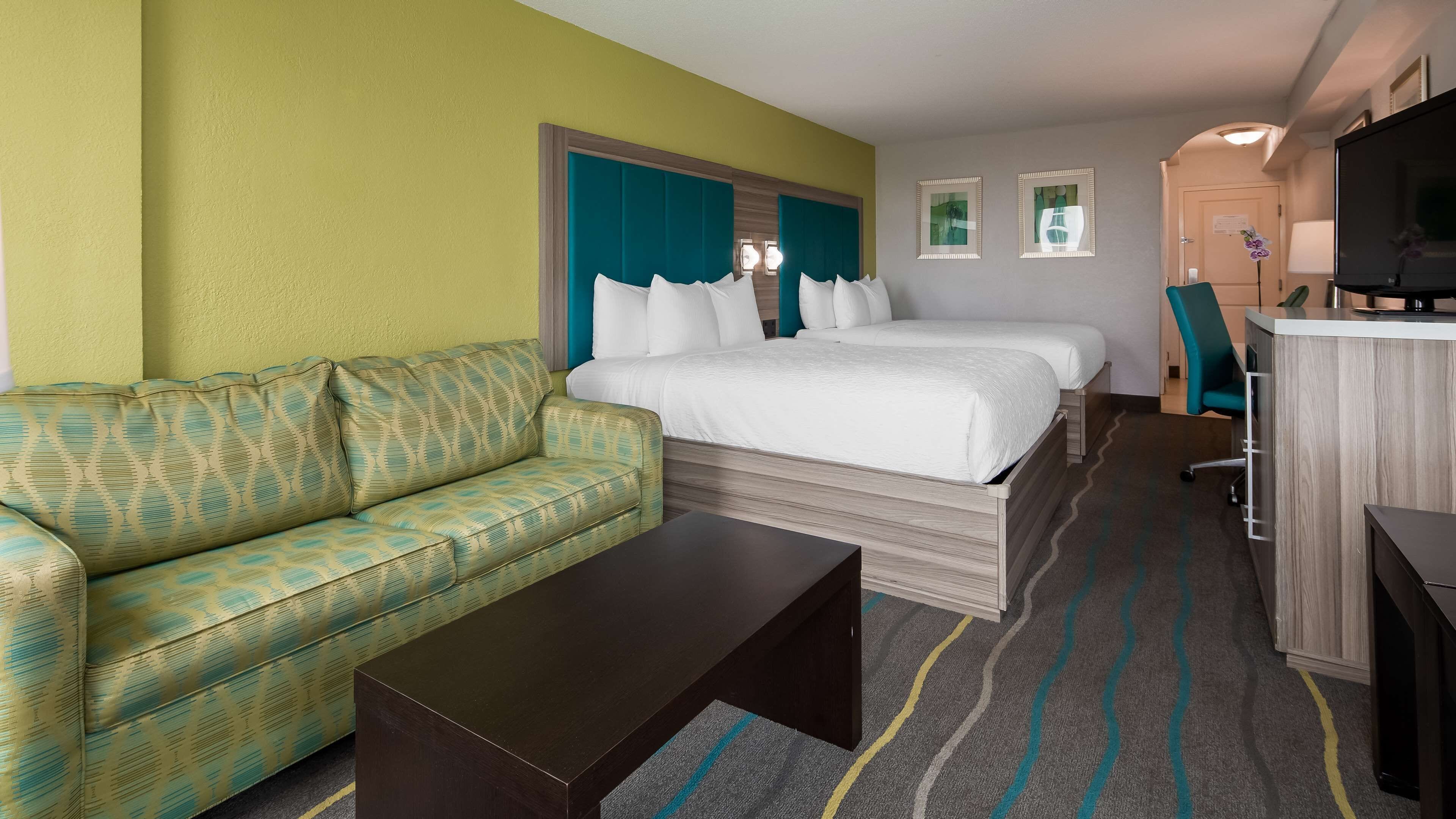 standard room, 2 queen beds, microwave, city view (shower only) | in-room safe, desk, laptop workspace, iron/ironing board