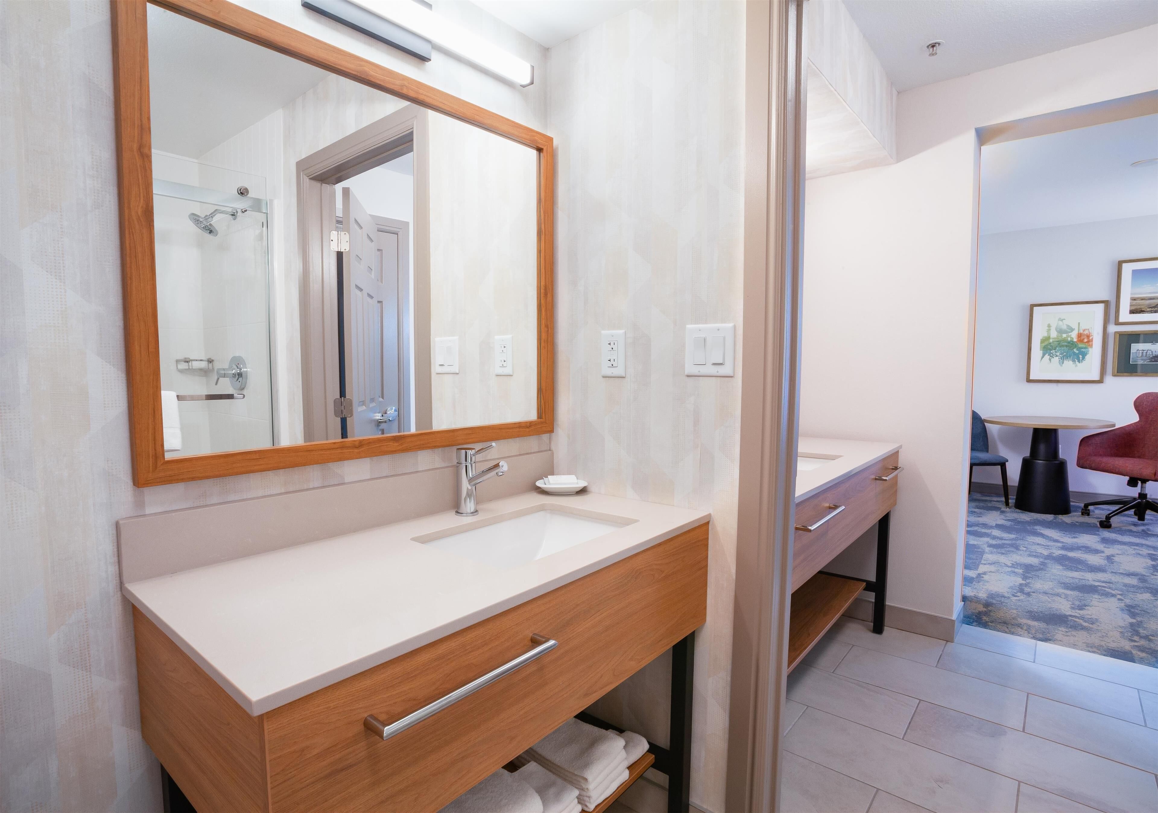 suite, 1 king bed, refrigerator | bathroom | free toiletries, hair dryer, towels