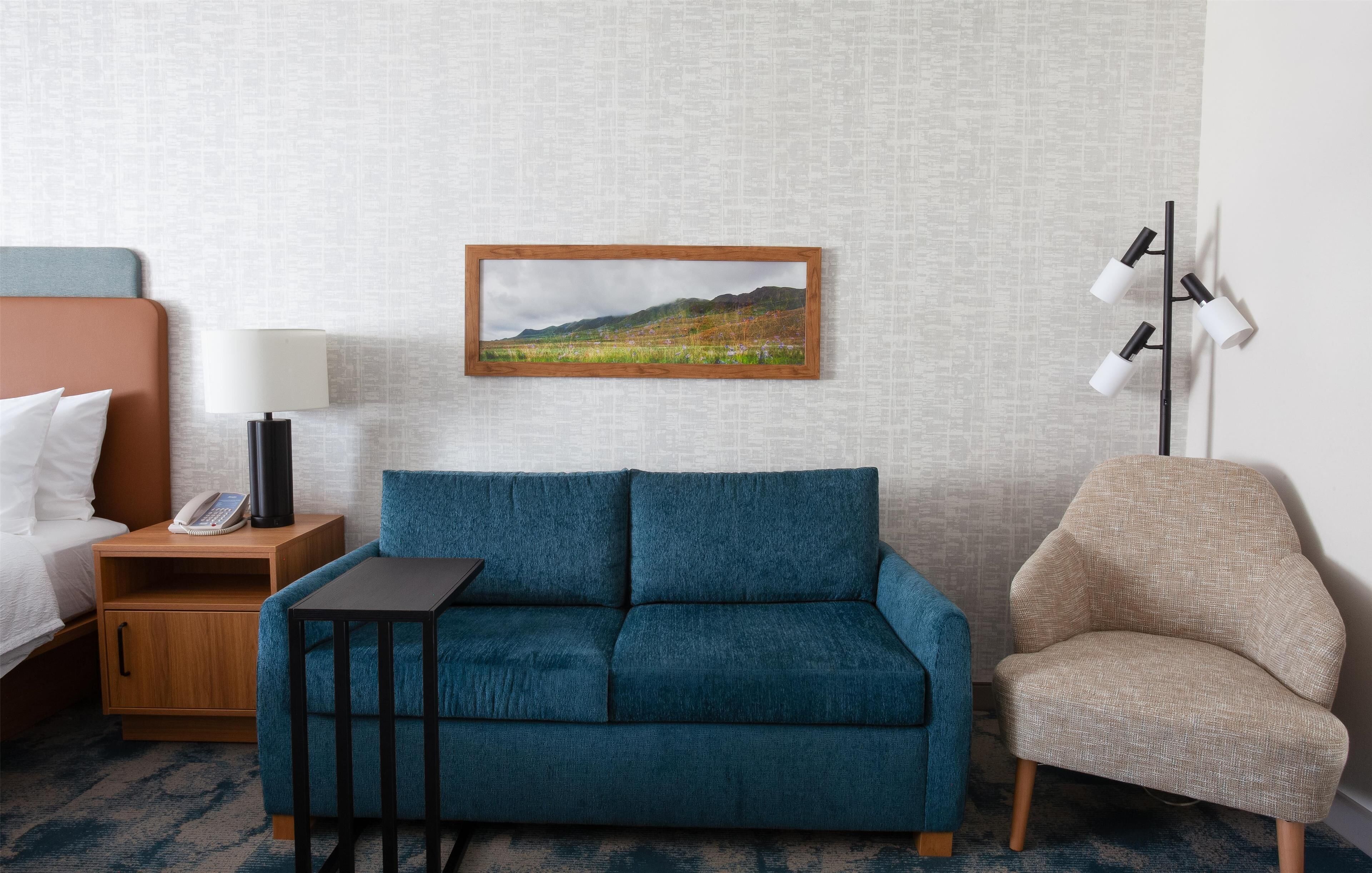 suite, 1 king bed, refrigerator | living area | 32-inch lcd tv with cable channels, tv