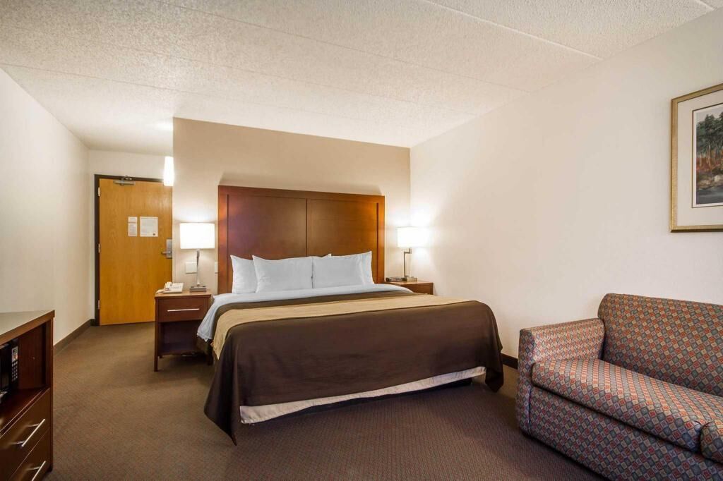 Premium bedding, desk, laptop workspace, blackout curtains