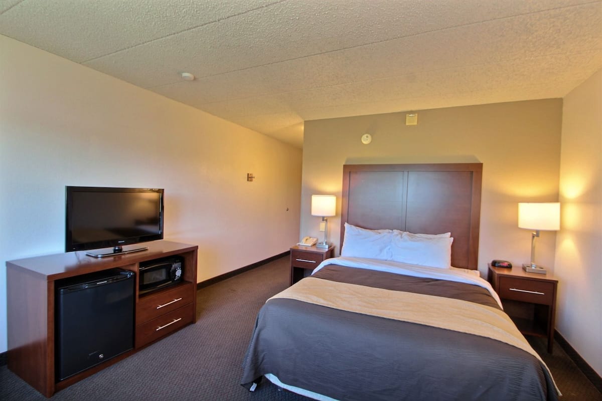 Premium bedding, desk, laptop workspace, blackout curtains