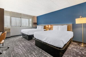 Premium bedding, desk, laptop workspace, blackout curtains