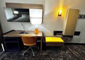 Premium bedding, desk, laptop workspace, blackout drapes