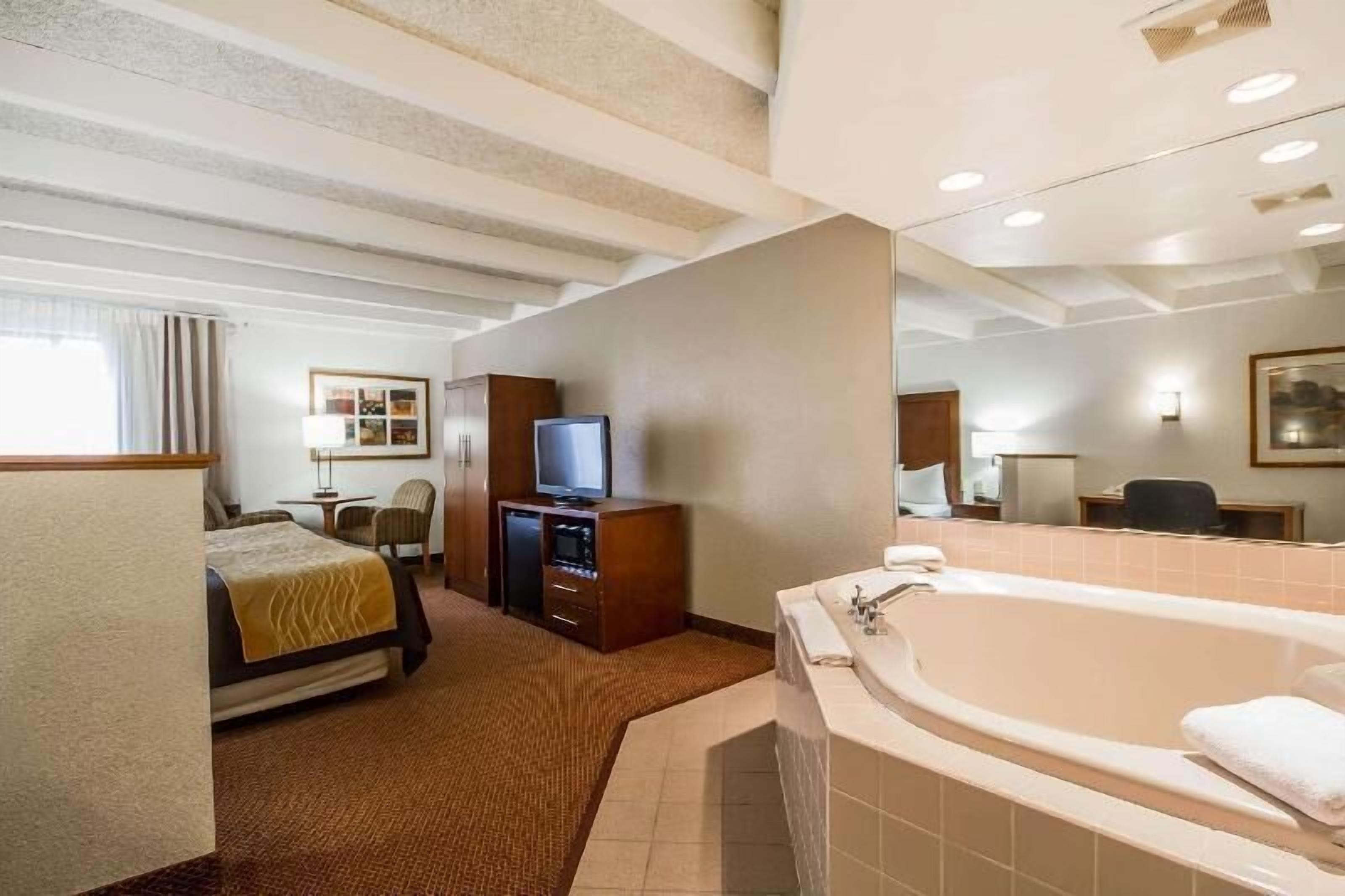 Premium bedding, desk, laptop workspace, blackout curtains