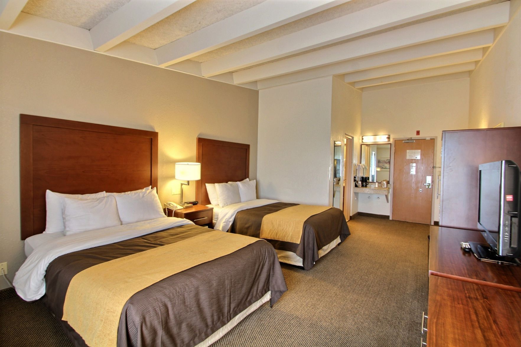 Premium bedding, desk, laptop workspace, blackout curtains