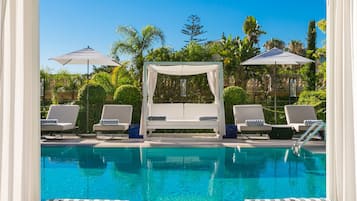 Indoor pool, seasonal outdoor pool, pool umbrellas, pool loungers