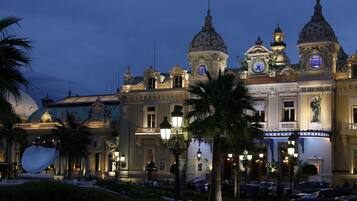 A grand building with ornate architecture, including domed roofs and decorative columns.