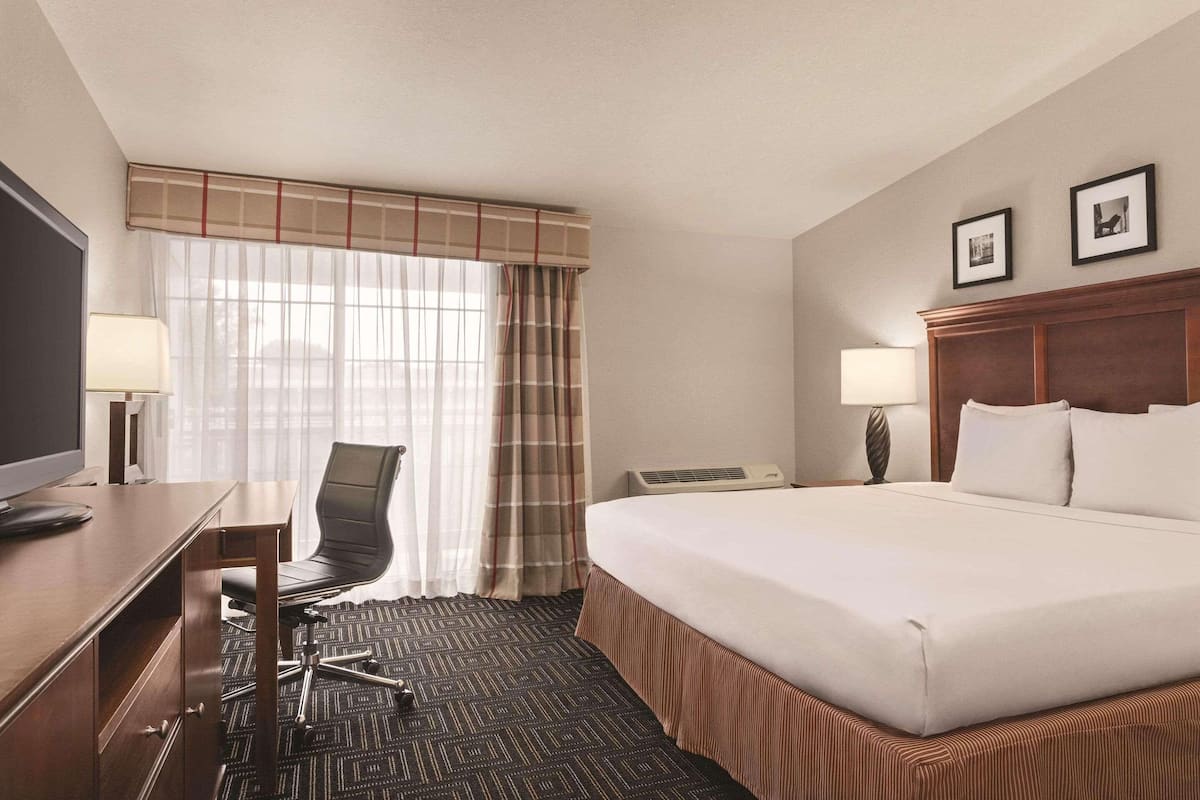 Premium bedding, pillow-top beds, desk, laptop workspace