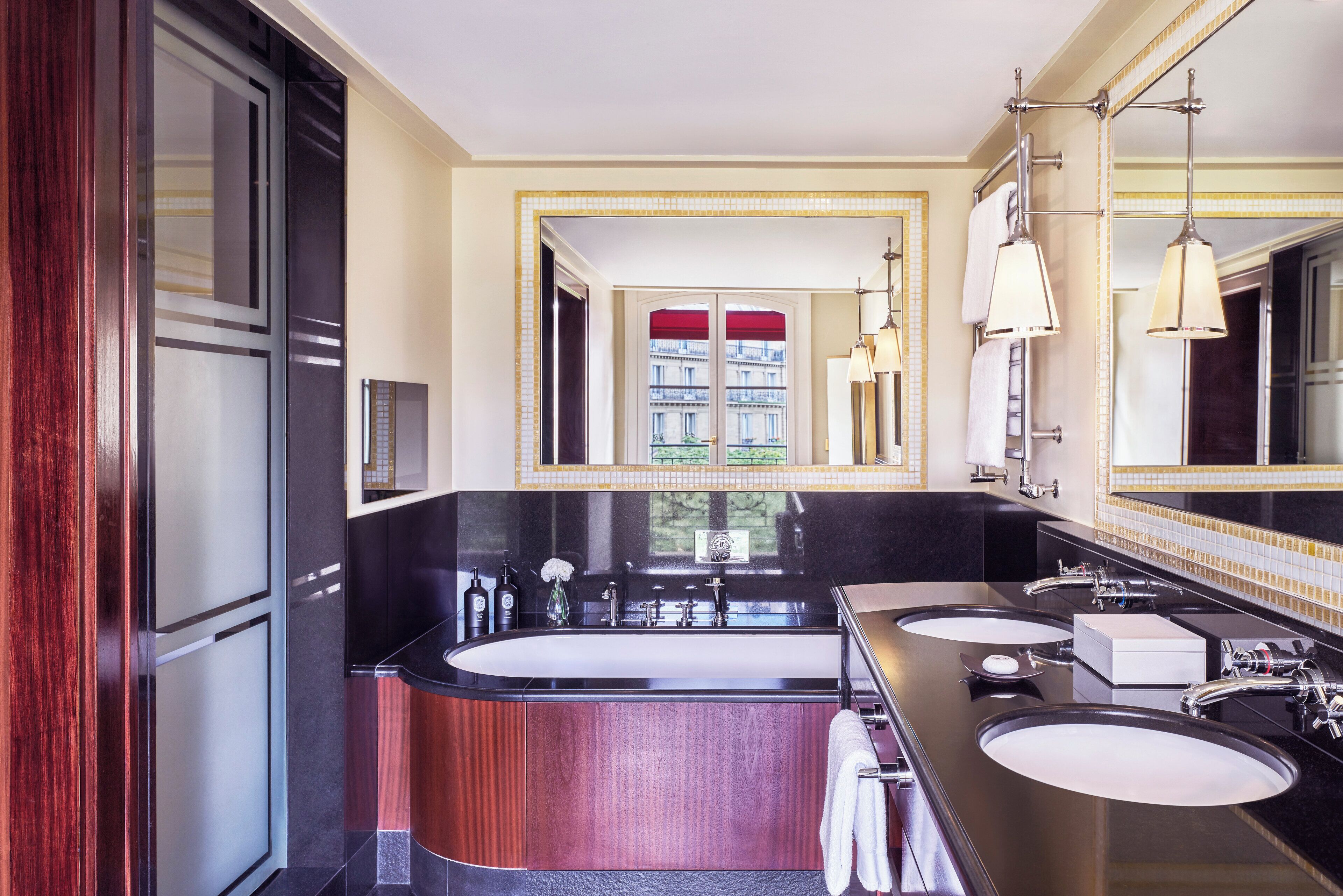 separate bathtub and shower, rainfall showerhead, designer toiletries