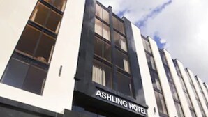 The Ashling Hotel facade with a modern design, large windows, and a clear sky. - Ashling Hotel Dublin (Dublin)