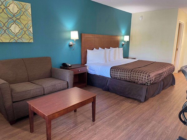 Premium bedding, desk, laptop workspace, blackout curtains